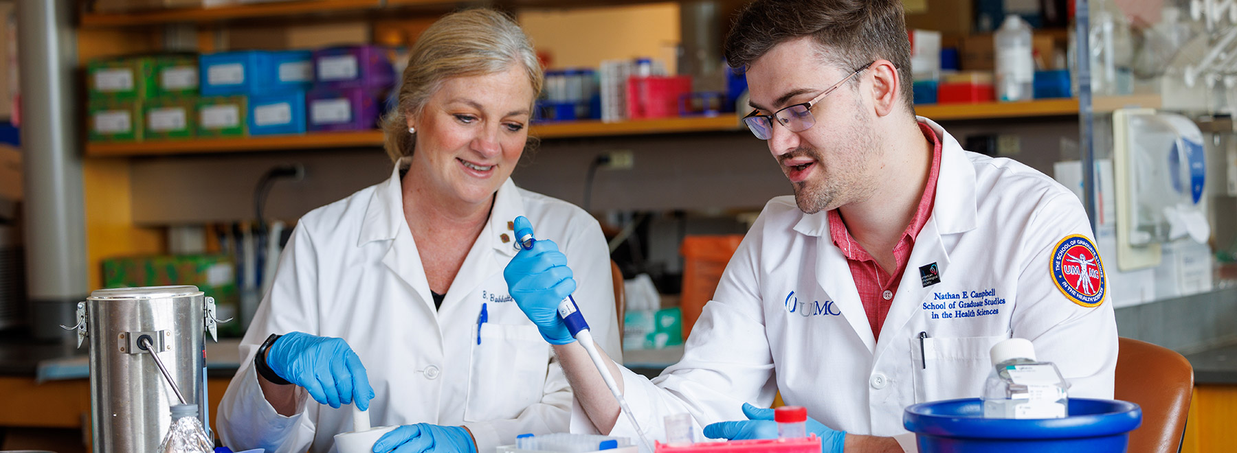 UMMC scientists Dr. Dr. Babette Lamarca and Dr. Nathan Campbell working in the laboratory.
